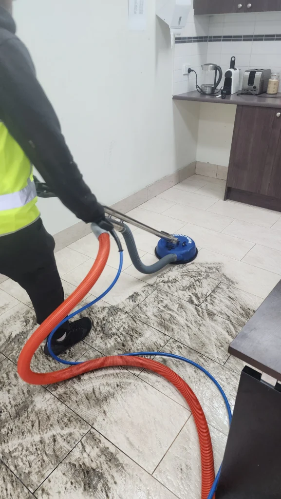 Professional tile and grout cleaning equipment being used on commercial flooring