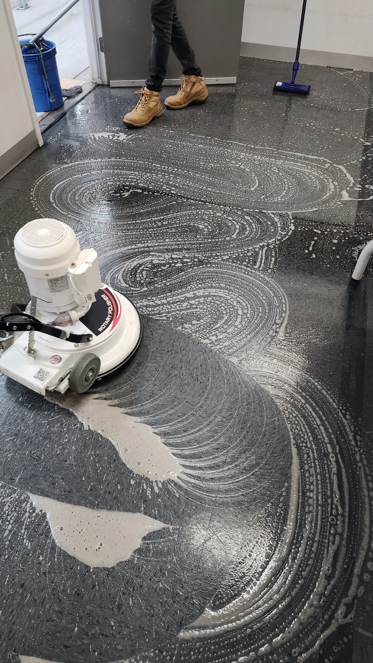 Floors That Impress: Professional Floor Scrubbing Guide Professional floor scrubbing machine cleaning commercial flooring in Springvale